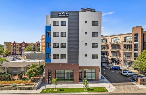 A modern building with the sign SPEER26 on the top.