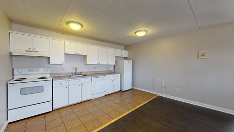A kitchen with white appliances and cabinets.