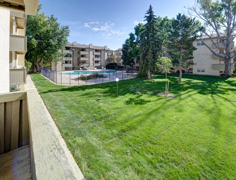 A sunny day at the poolside of a residential area.