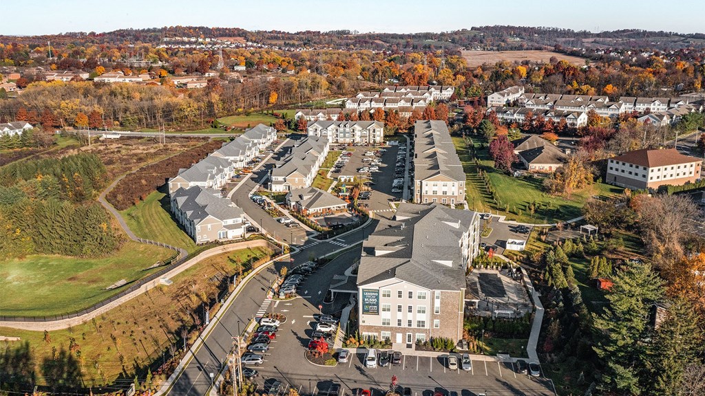 an aerial view of a city with buildings and trees