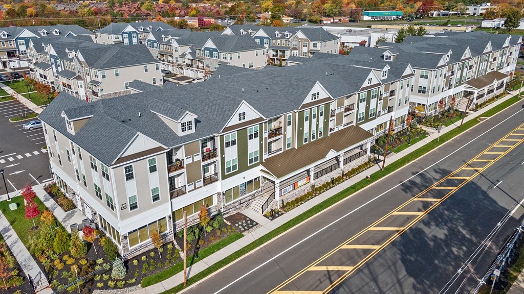 an aerial view of a row of houses on a street