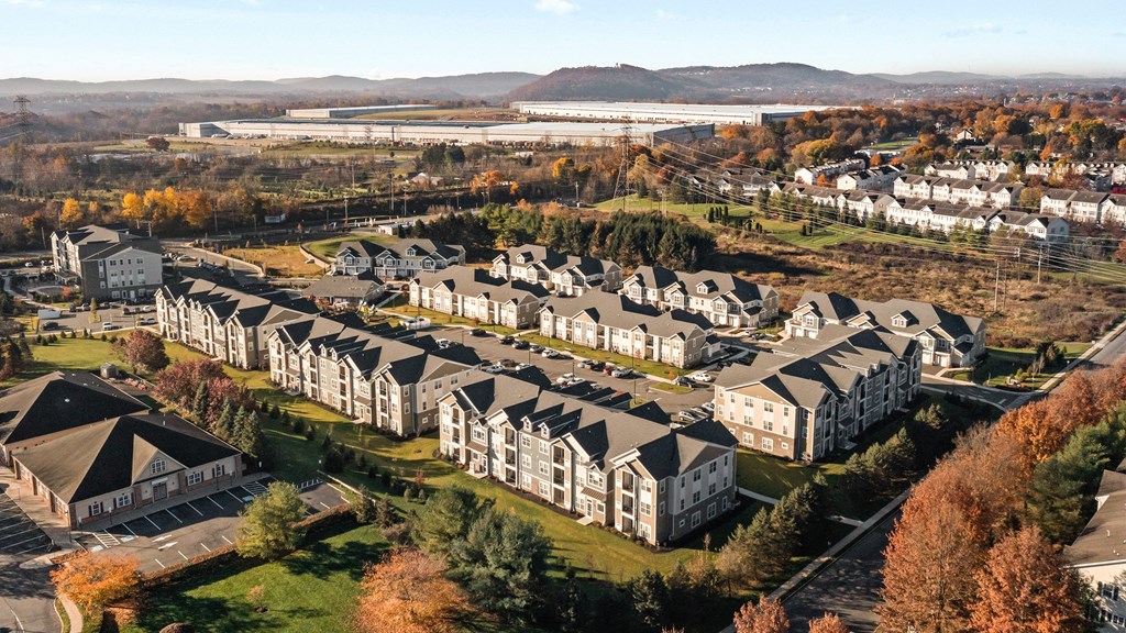 an aerial view of houses in a suburb of a city