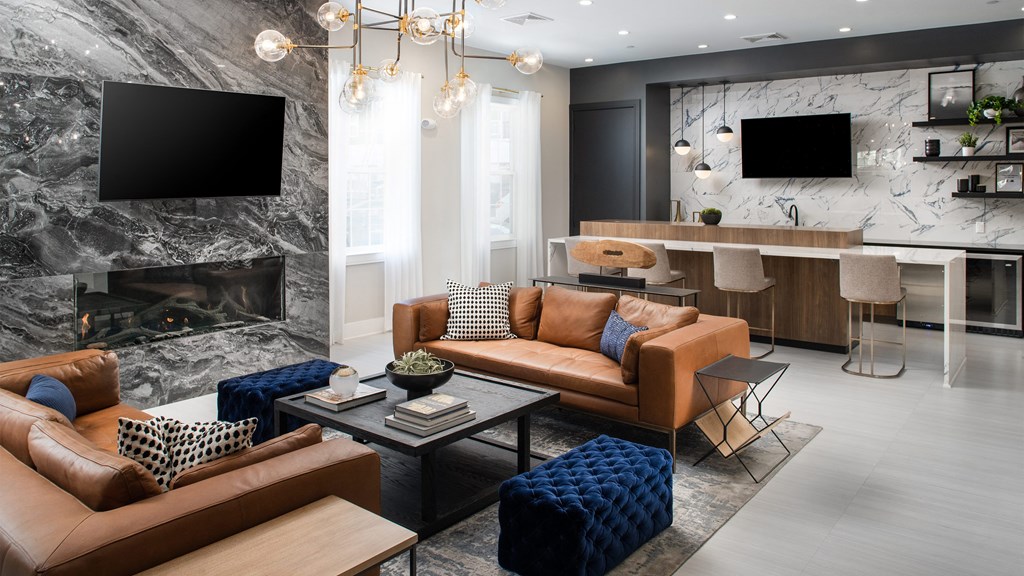 a living room with couches and a coffee table and a fireplace