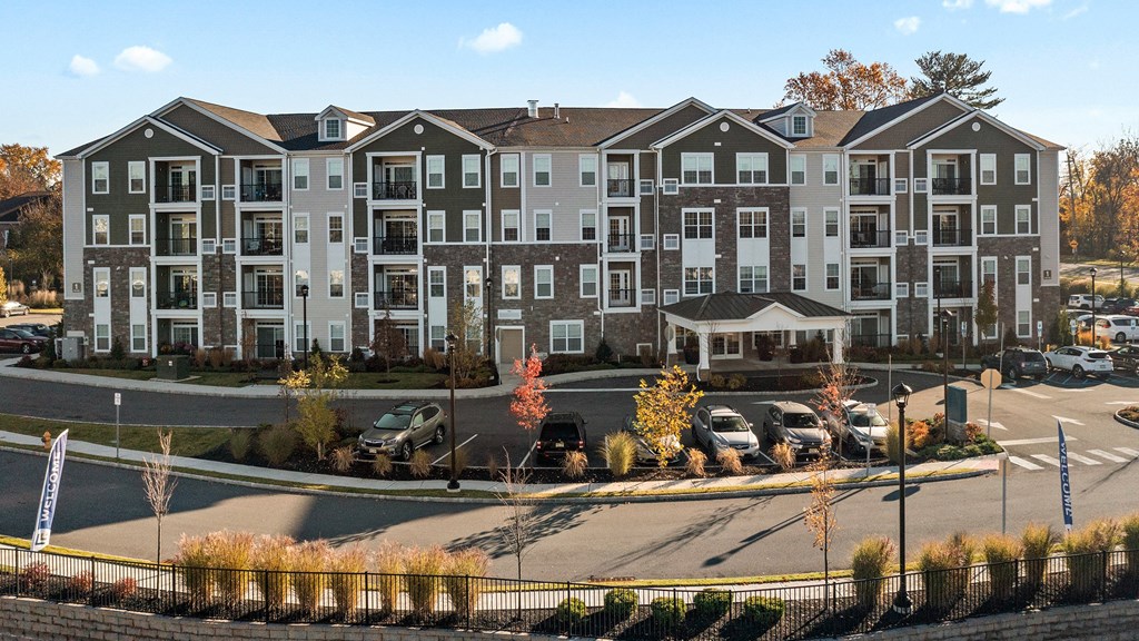 an aerial view of an apartment building on a parking lot