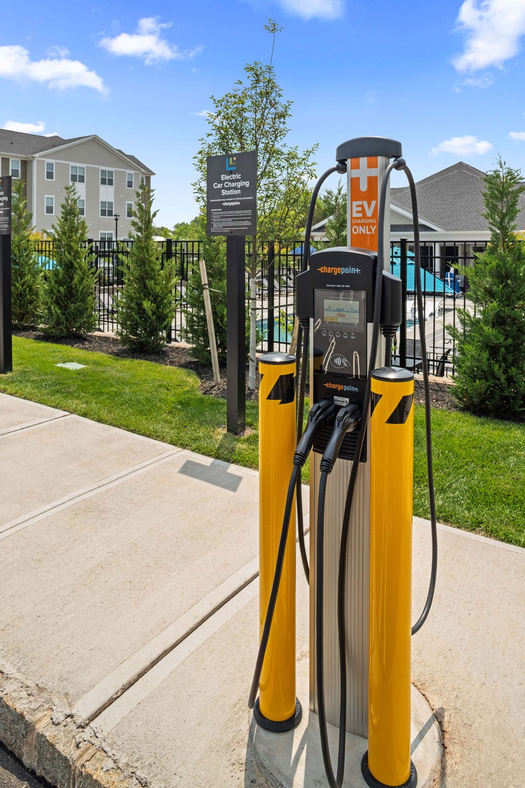 a gas pump at a gas station on a sidewalk