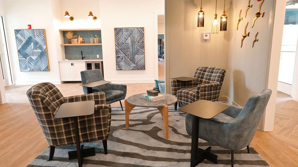 a living room filled with furniture and a rug