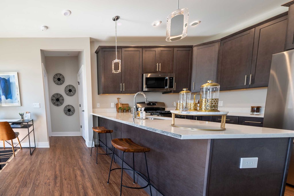 a kitchen with a counter top and a refrigerator