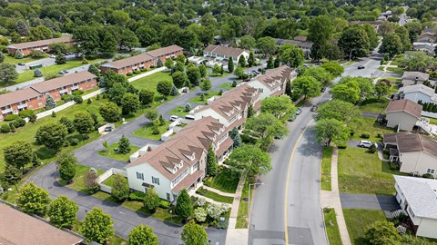 A residential area with houses and trees.