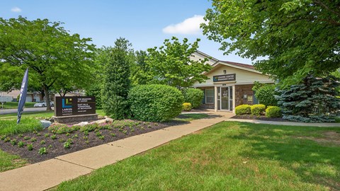 A building with a sign in front of it.