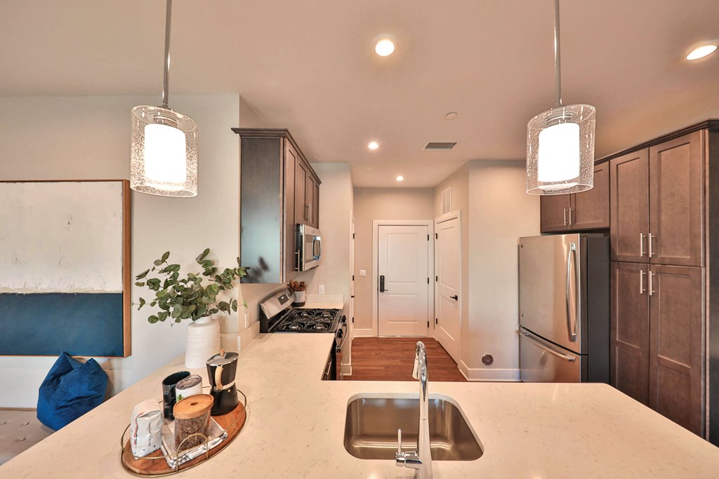 a kitchen with a sink and a counter top
