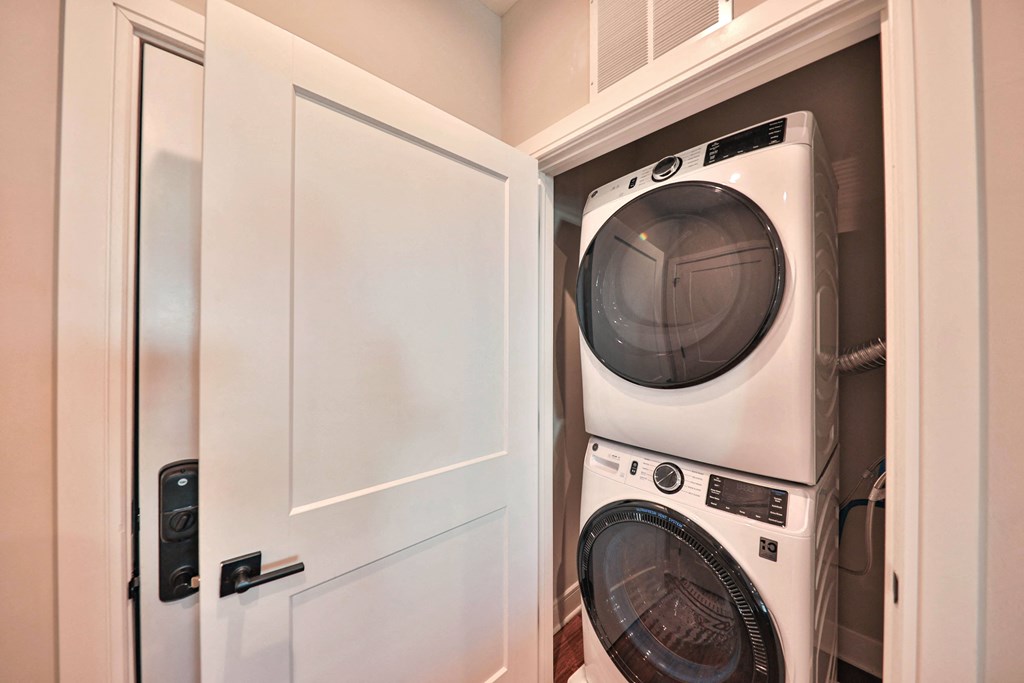 a small laundry room with a washer and dryer