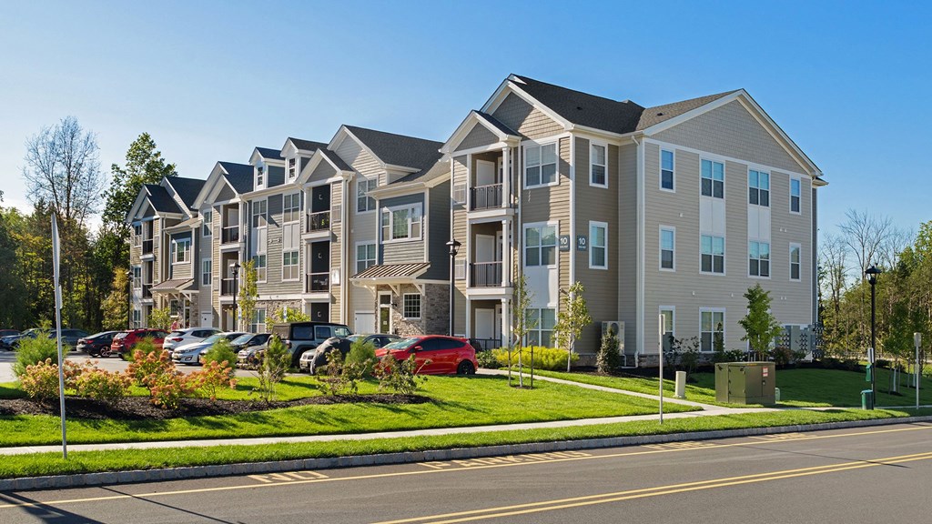 an apartment building on the side of a street