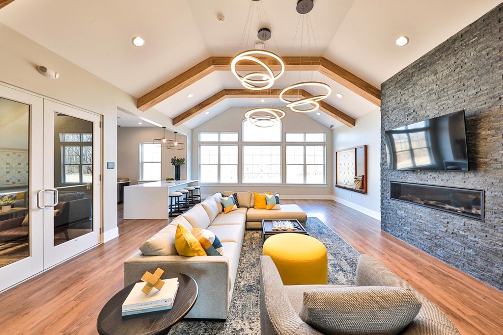 a living room with couches and a fireplace