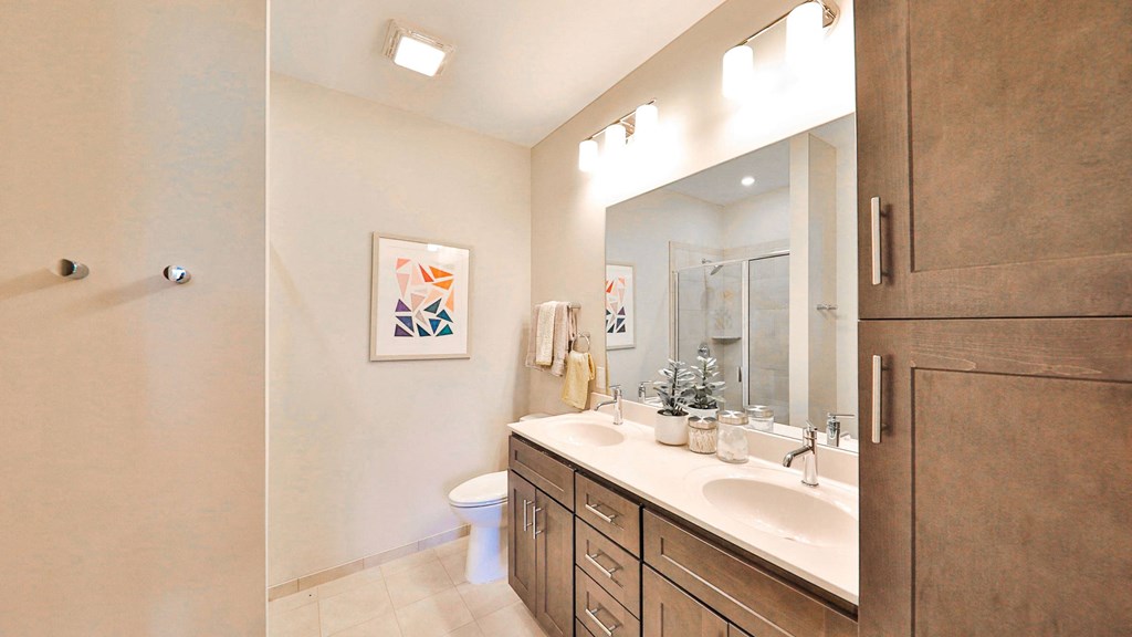 a bathroom with a sink and a toilet and a mirror