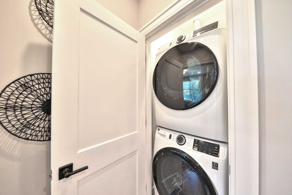 a small laundry room with a washer and dryer