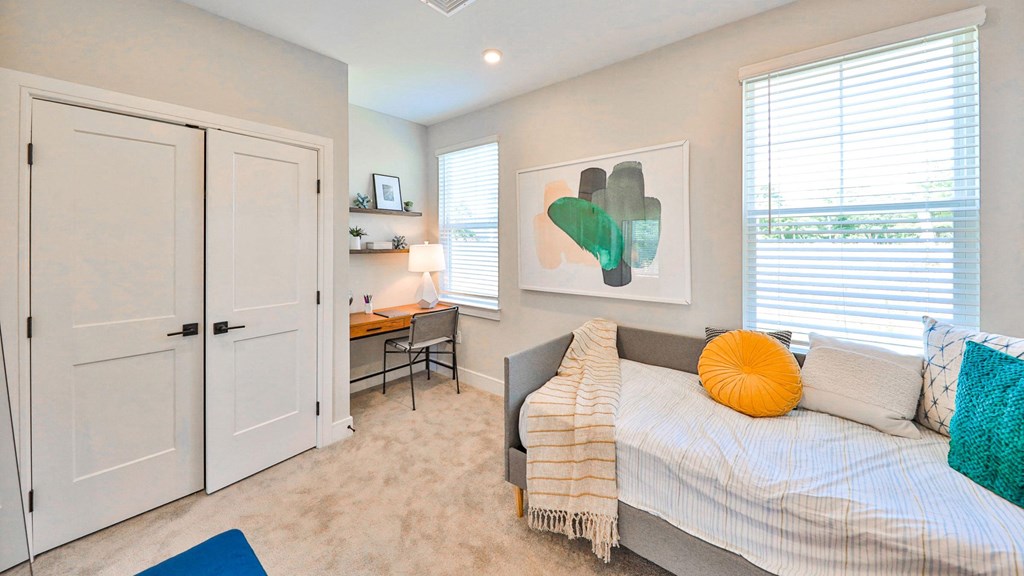 a bedroom with a bed and a closet