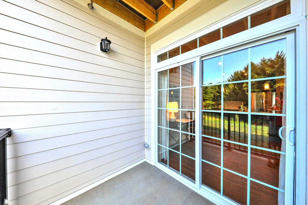 a large glass door on the side of a house