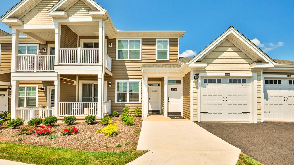 a house with a sidewalk in front of it