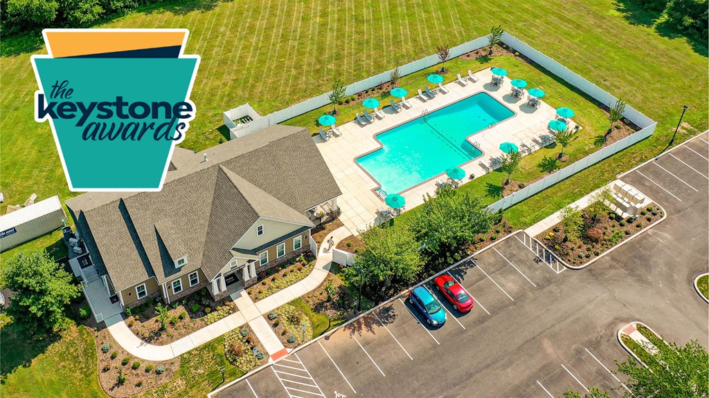 a house with a swimming pool and a logo for the bedroom awards