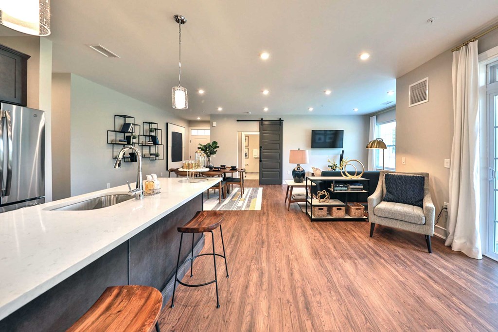 a large living room with a kitchen and a dining room