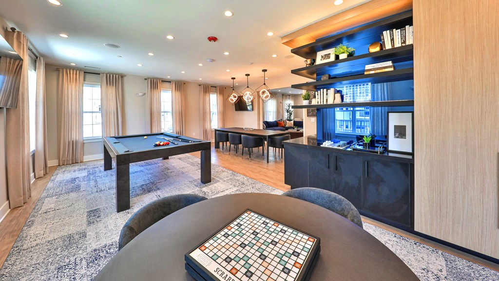 a game room with a pool table and a billiard table
