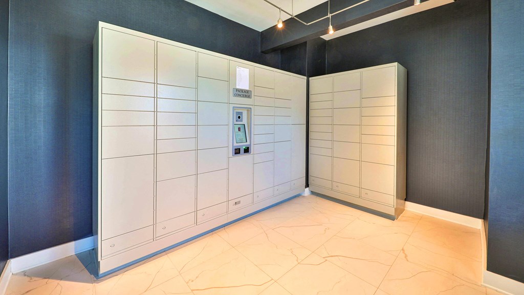 a set of white lockers in a room with a tile floor