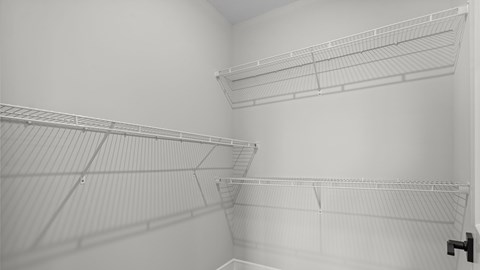Empty white shelves in a room.