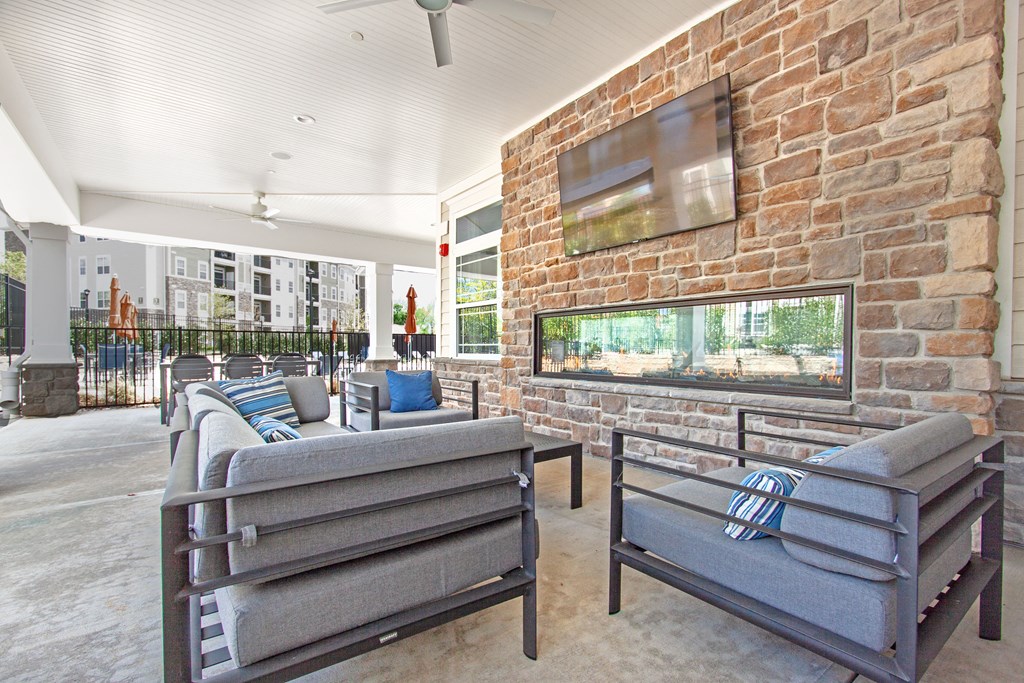 the preserve at ballantyne commons living room with couches and a fireplace