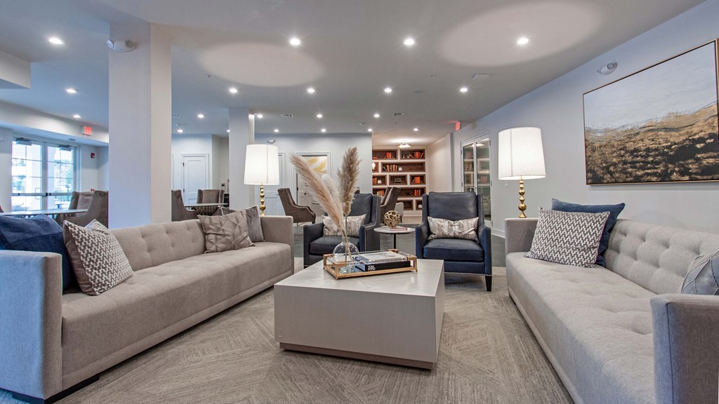 a living room with couches and chairs and a coffee table