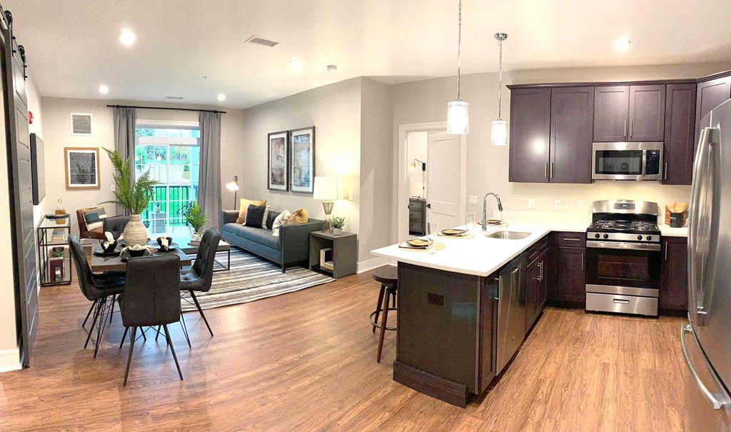 an open floor plan with a kitchen and living room