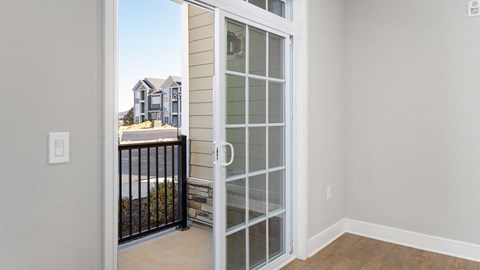 A view of a house through a glass door.