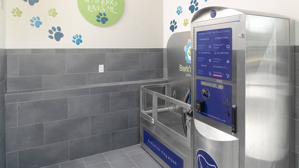 a vending machine in a public restroom with the door open