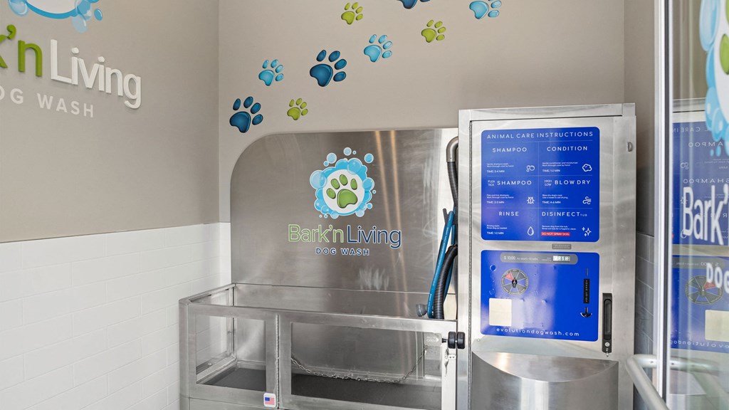 a water dispenser in a bathroom with a sink and a refrigerator