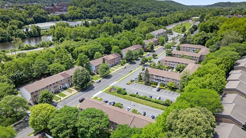 A bird's eye view of a residential area with houses and trees.
