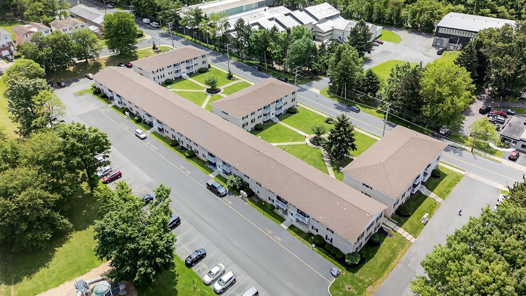A large building with a parking lot in front of it.
