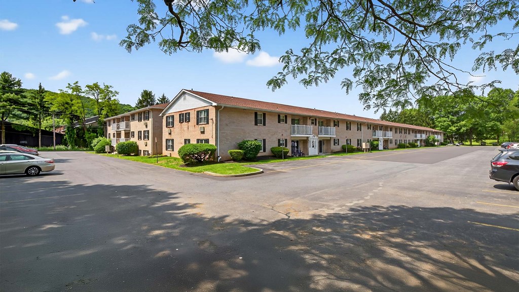 A parking lot with a building in the background.
