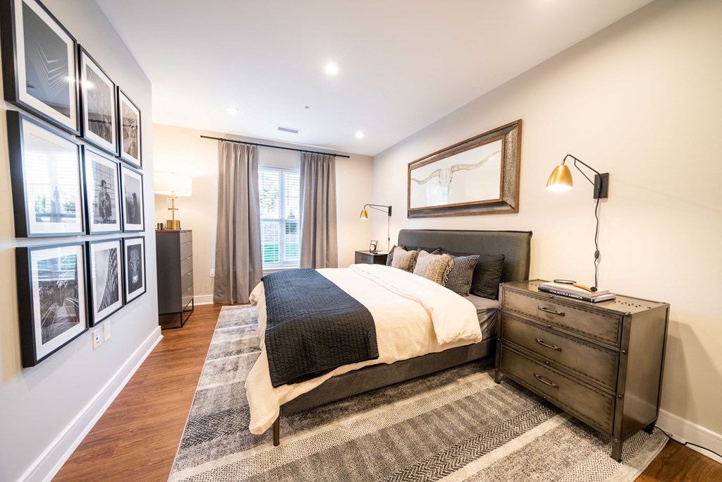 a bedroom with a bed and a dresser