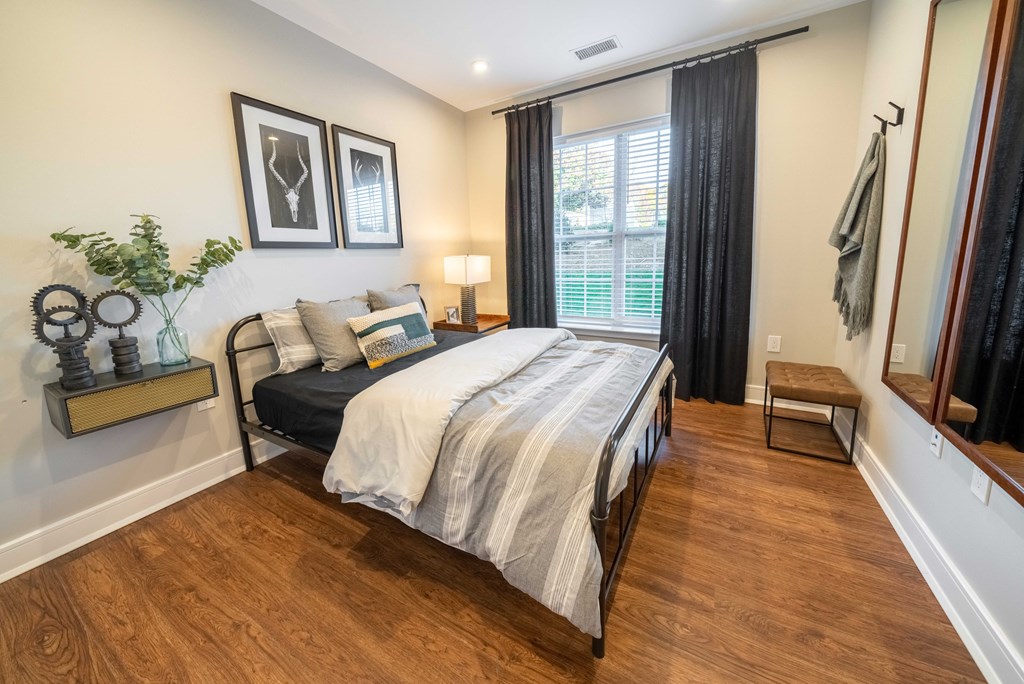 a bedroom with a bed and a window