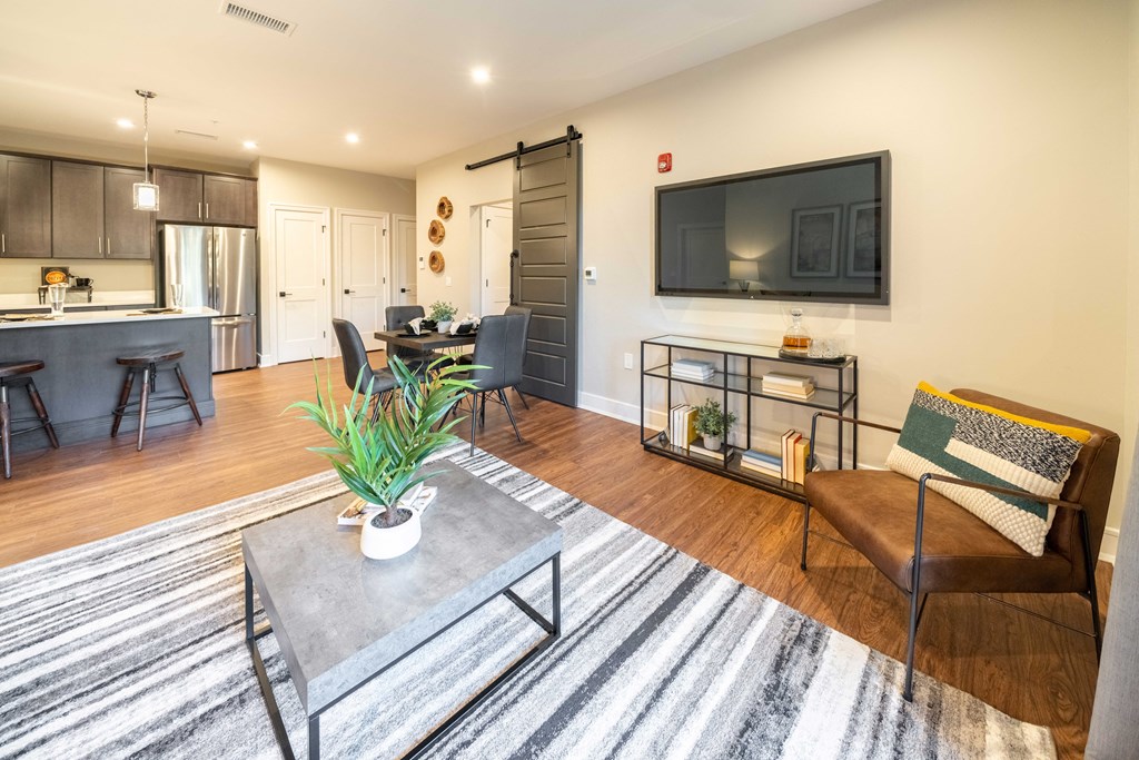 a living room with a couch and a coffee table and a television