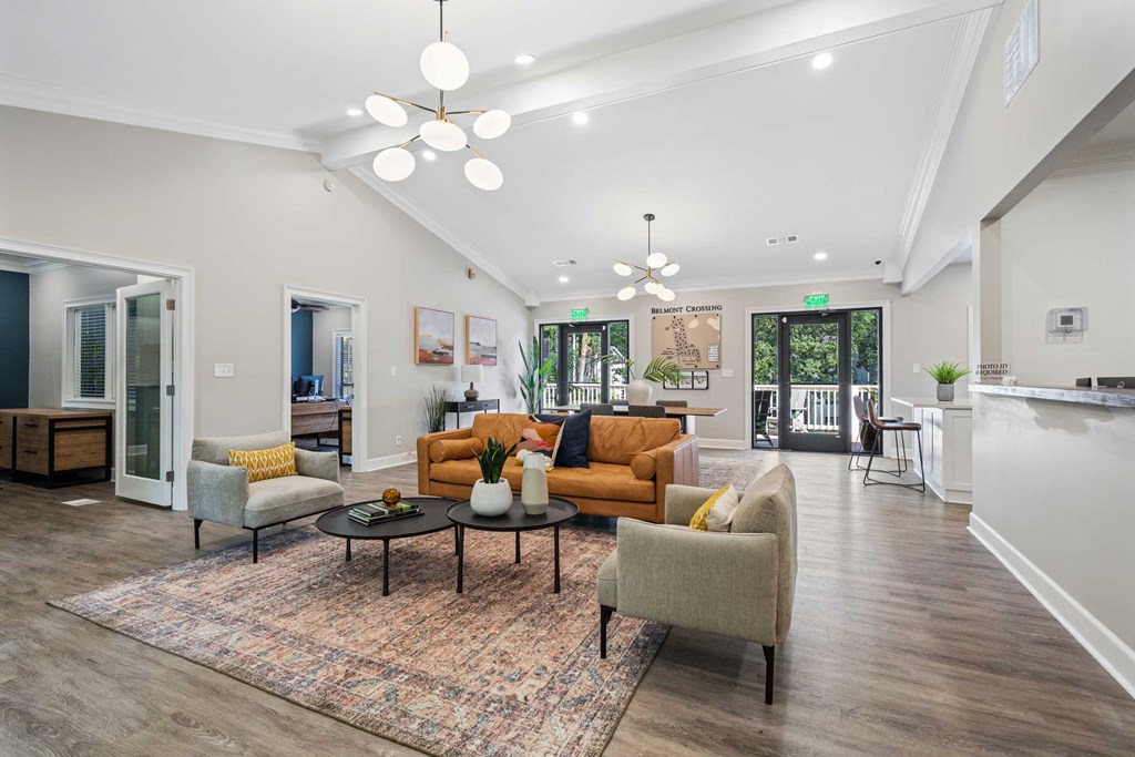 a living room with couches and chairs and a table
