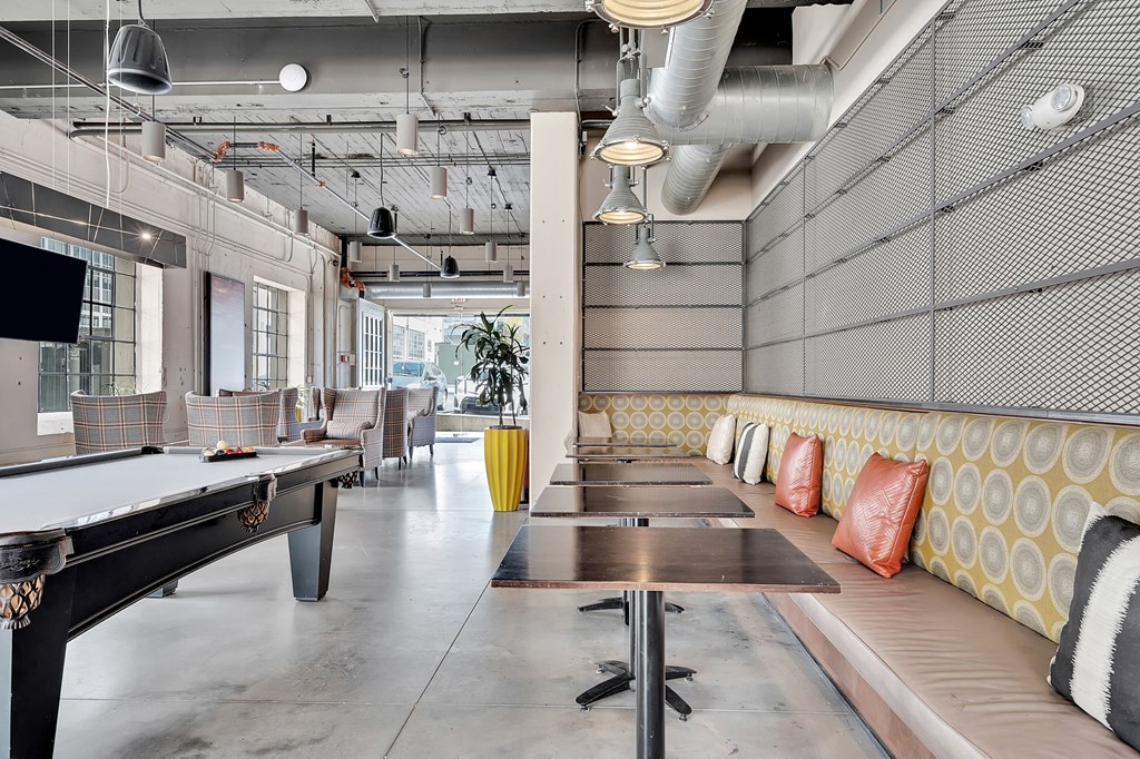 a game room with ping pong tables and a pool table