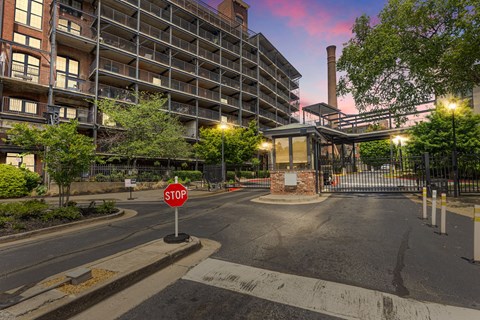 an empty street with a stop sign in front of a building
