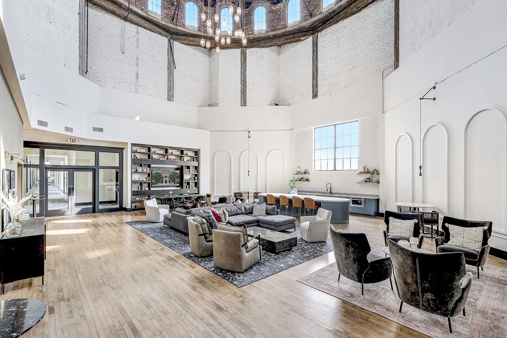 a living room filled with furniture and a large window