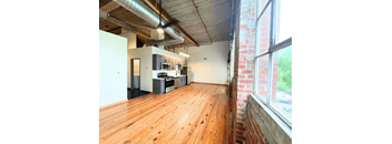 an open floor plan with a kitchen and living room