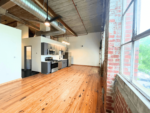 an open floor plan with a kitchen and living room