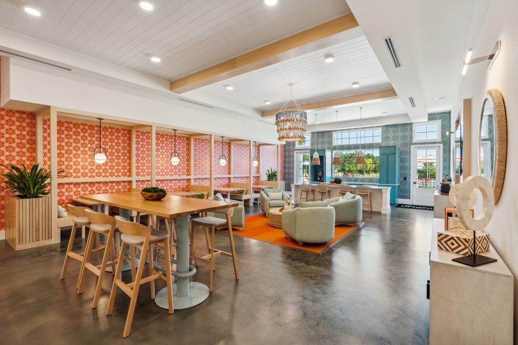A modern dining room with a wooden table and chairs.