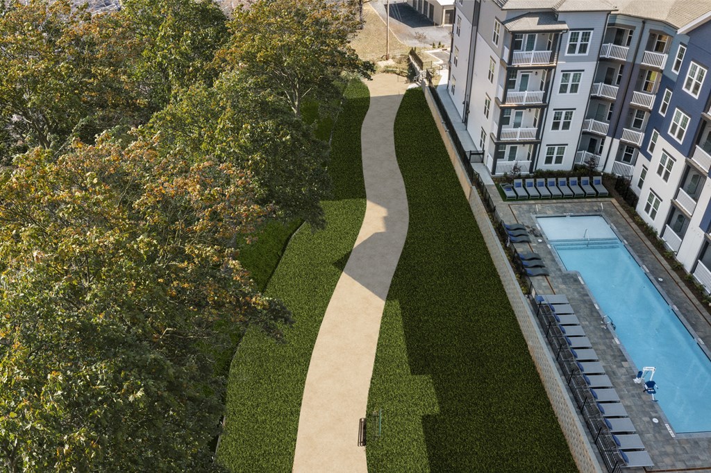 a view of a pool and a building from above