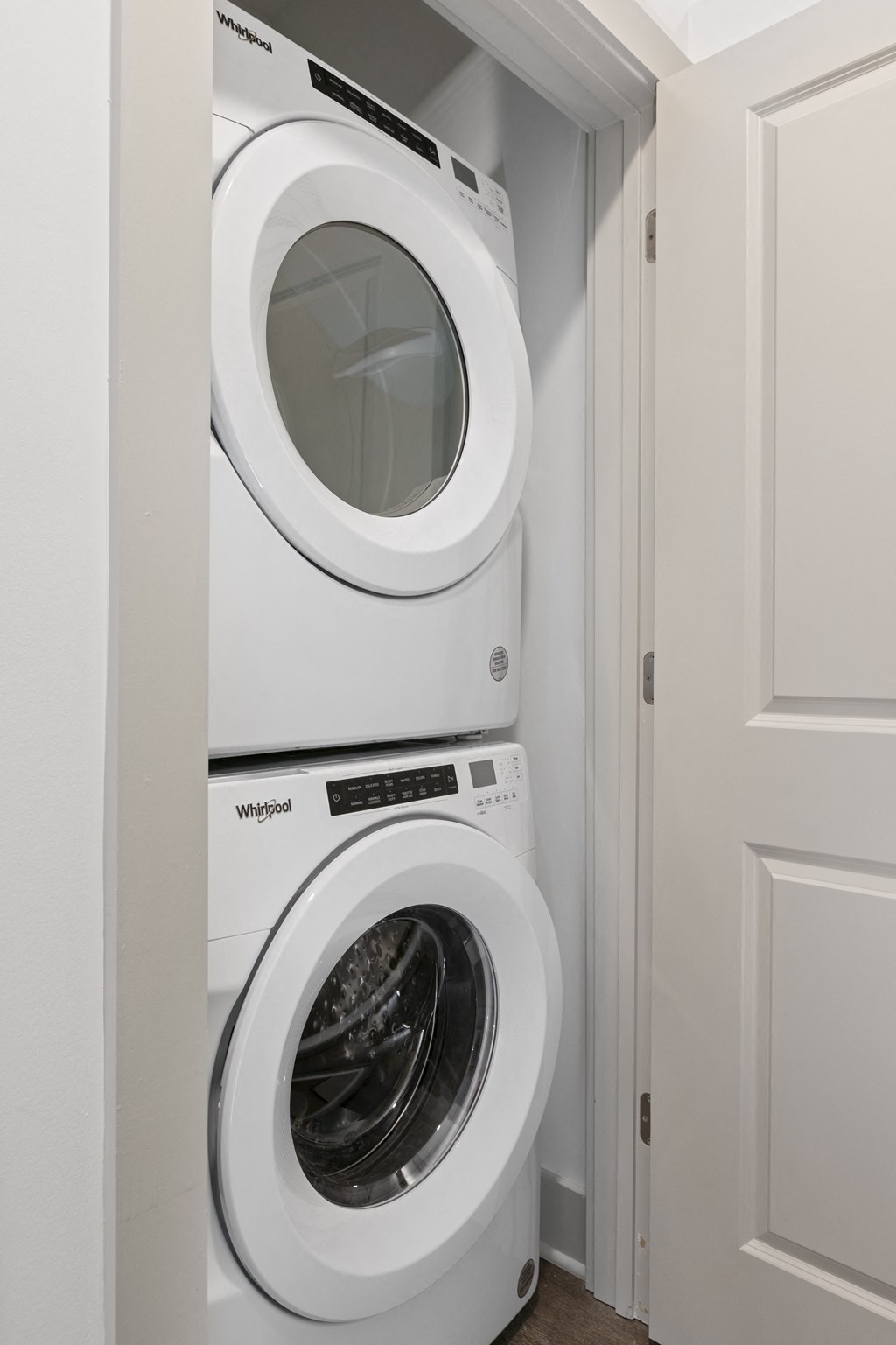 a washer and dryer in a small laundry room