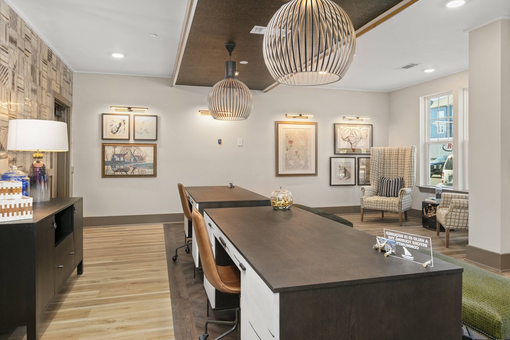 a dining room with a long table and chairs
