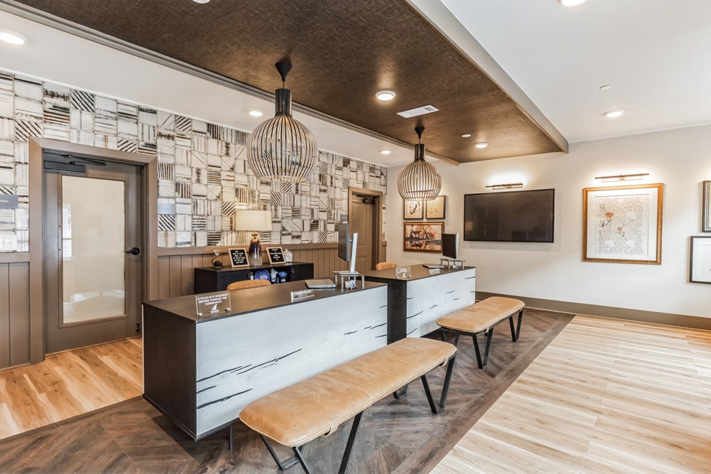 a lobby with a reception desk and a tv